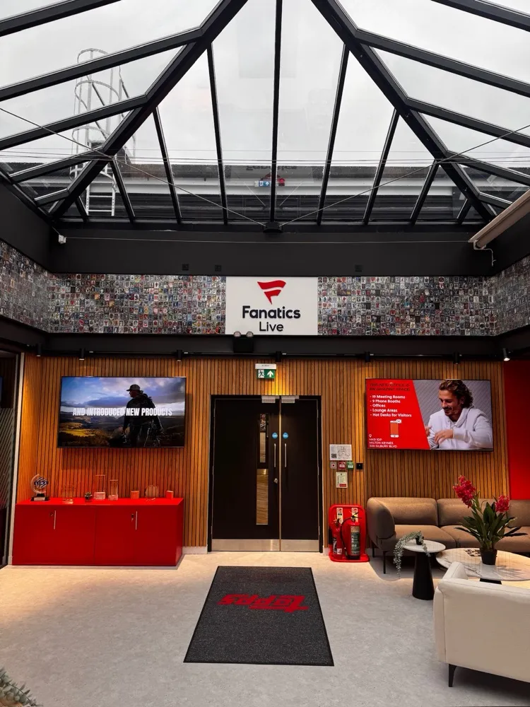 Reception atrium with a glazed roof and digital signage displays